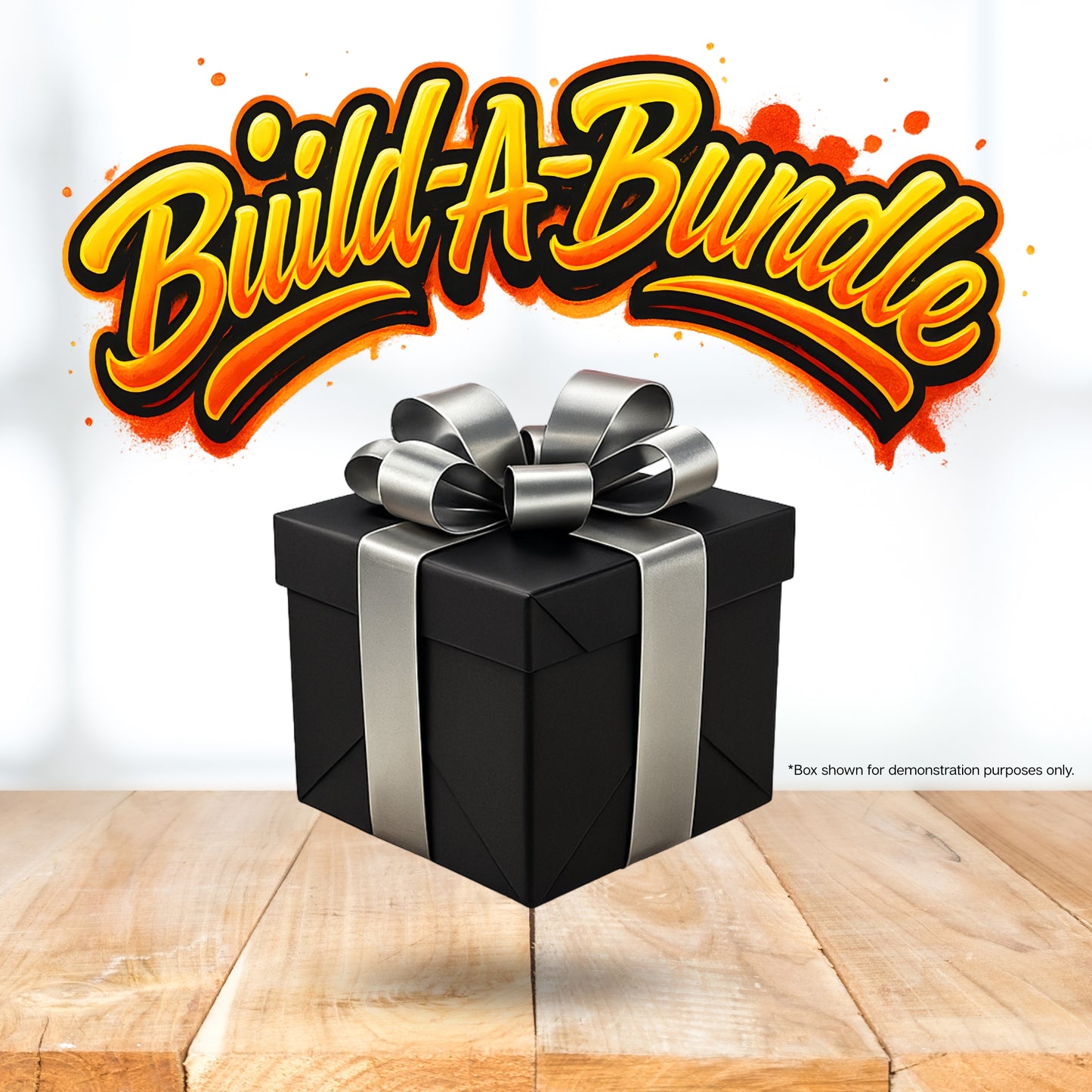 Black gift box with a silver ribbon on a wooden surface, featuring 'Build-A-Bundle' text above.