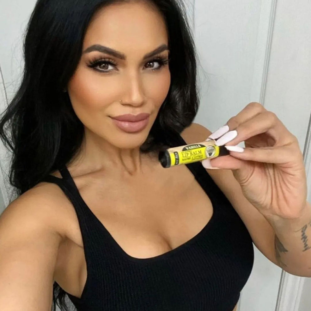 Model Kim Lu using a lip balm from Nickel City Beard Blends 