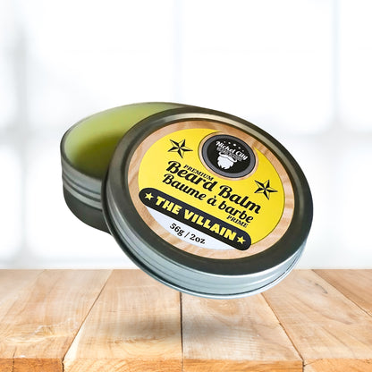 Beard balm container with yellow label on a wooden surface