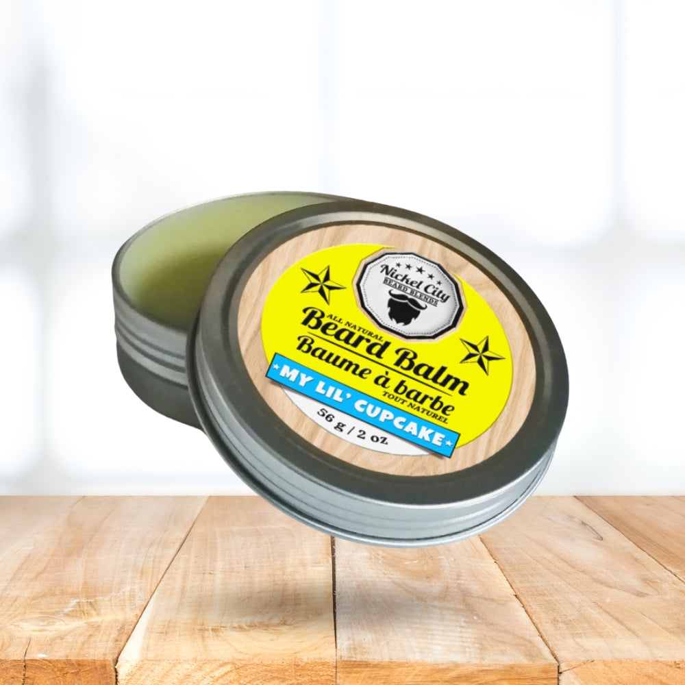 Beard balm container with yellow label on a wooden surface