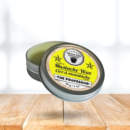Mustache wax container with yellow label on a wooden surface