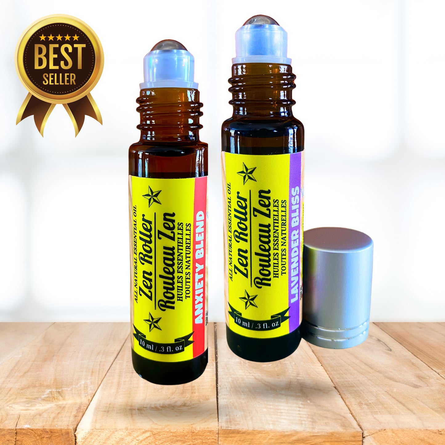 Two Zen Roller Zen essential oil bottles on a wooden surface with a white background.