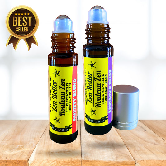 Two Zen Roller Zen essential oil bottles on a wooden surface with a white background.
