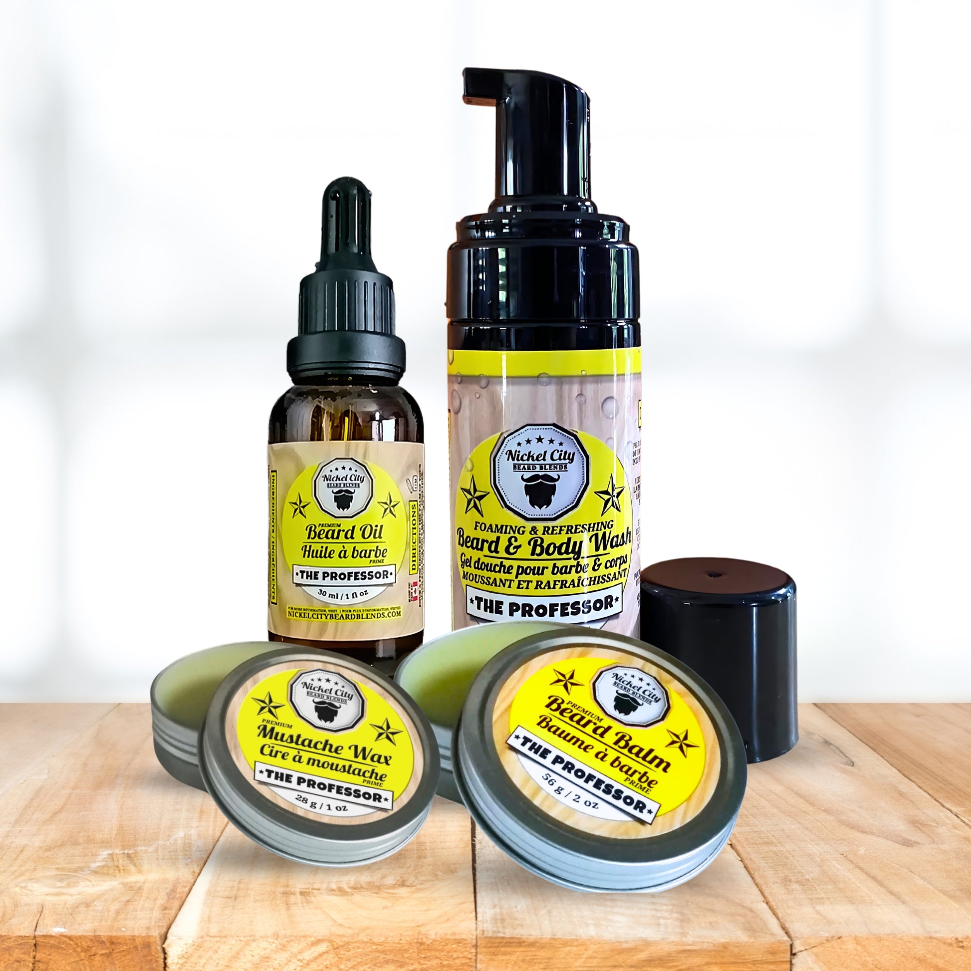 Collection of beard care products including oil, balm, shampoo and wax on a wooden surface with a white background.