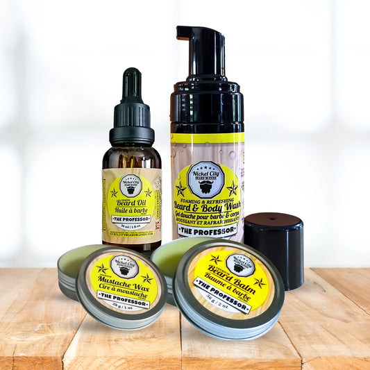Collection of beard care products including oil, balm, shampoo and wax on a wooden surface with a white background.