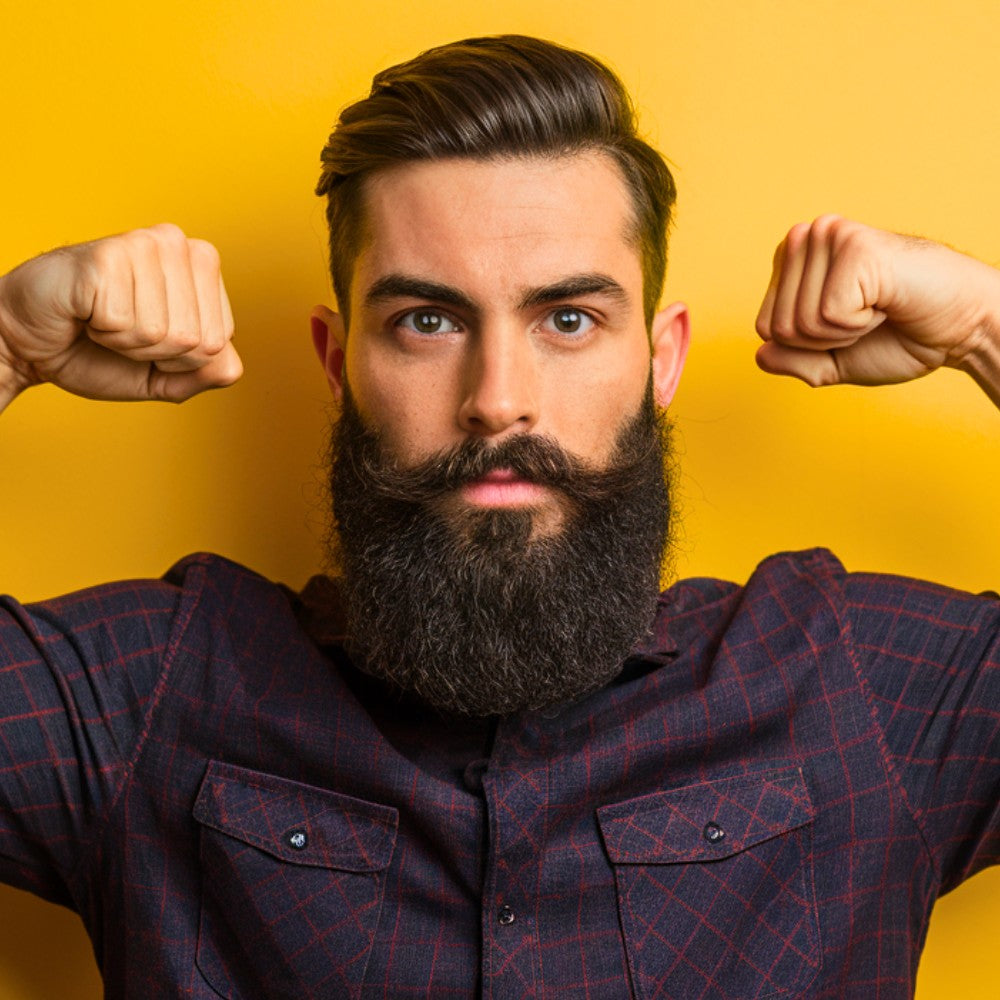 Bearded man flexing his arms