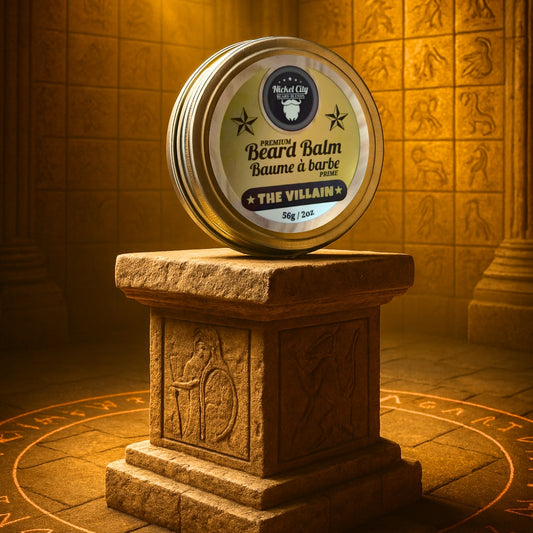 Beard balm container labeled 'The Villain' on a stone pedestal with an ornate background